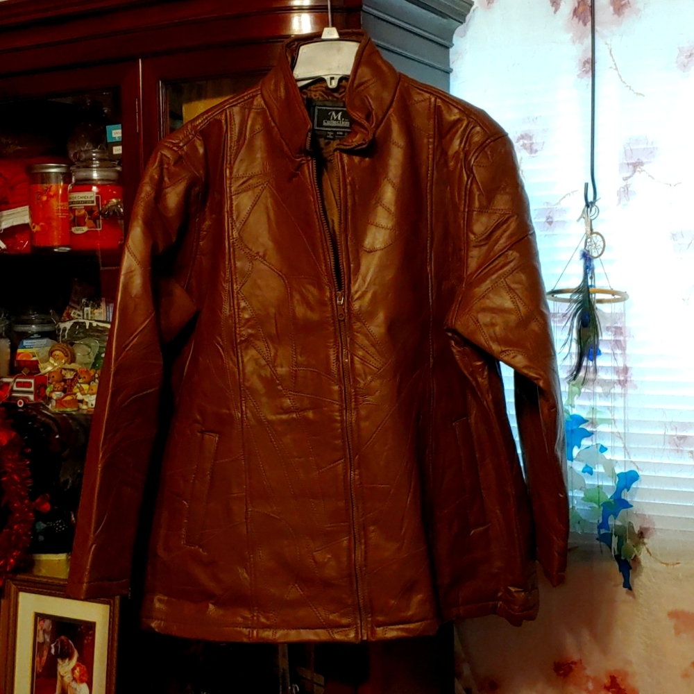 M collection leather coat, size 2xl womens, fits like a XL. New never worn